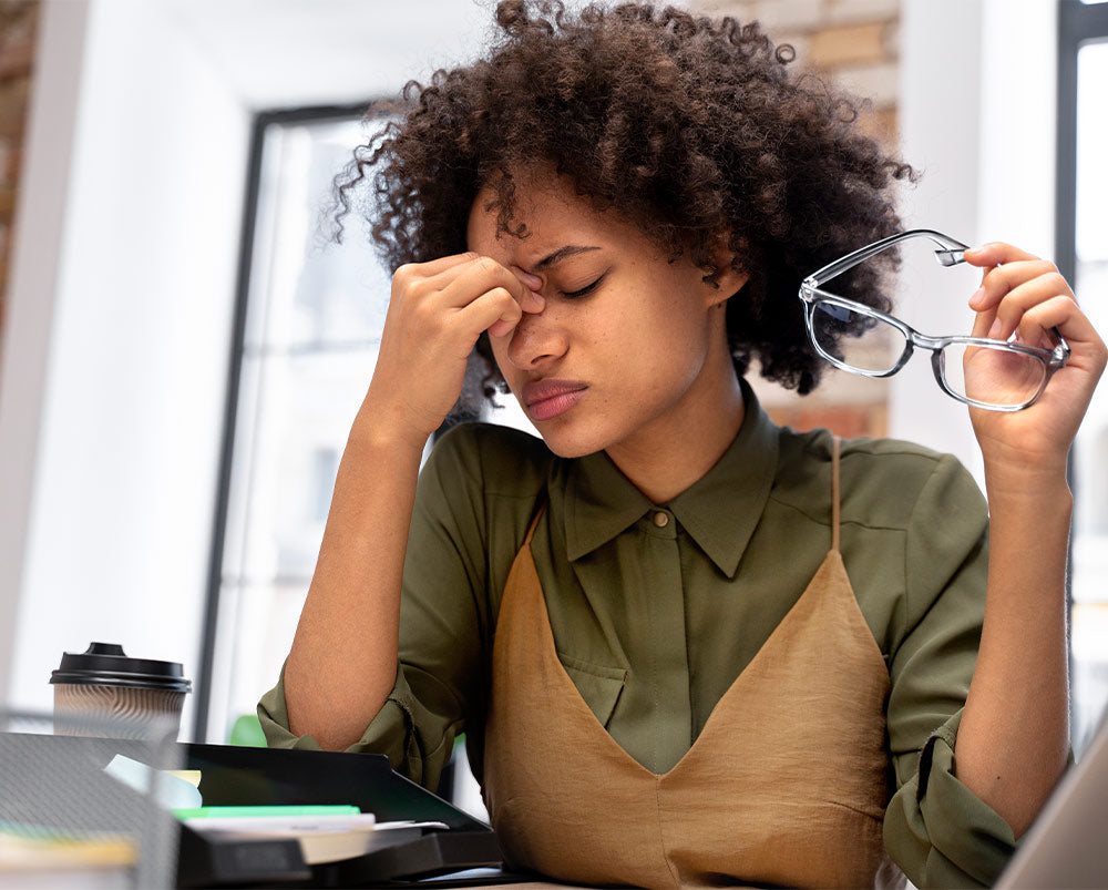 Dry-tired-eyes-woman-holding-glasses