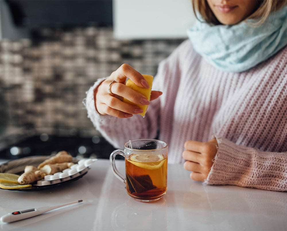 common-cold-and-flu-symptoms-women-making-tea-with-lemon
