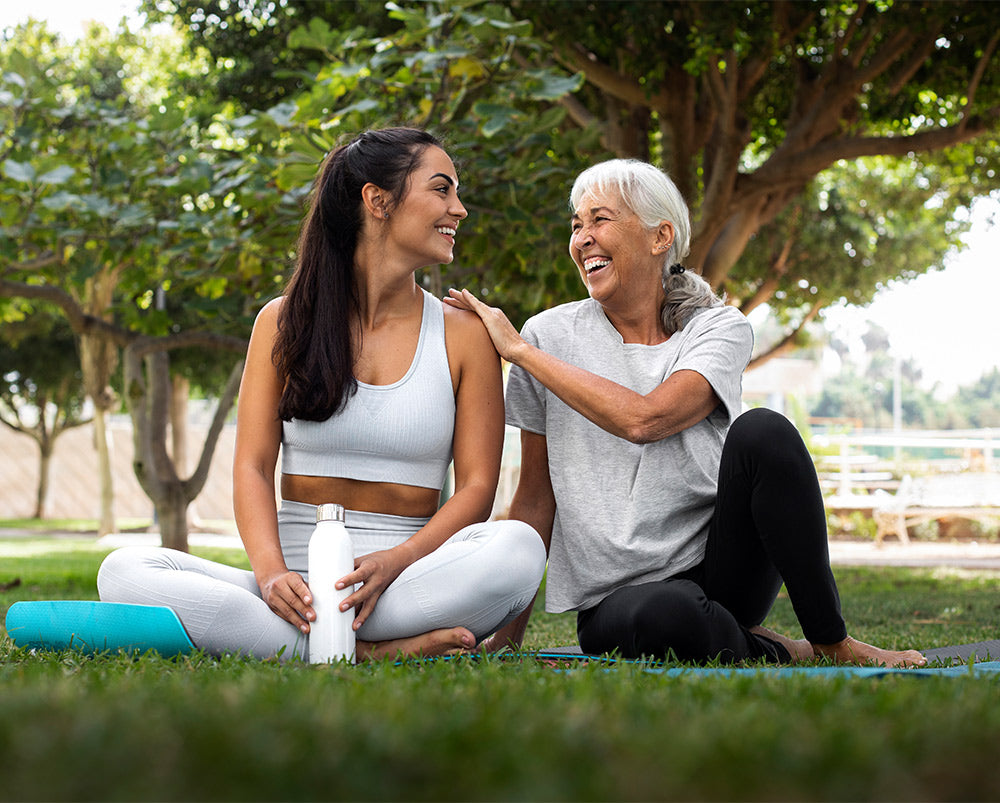 friends-doing-yoga-together-park